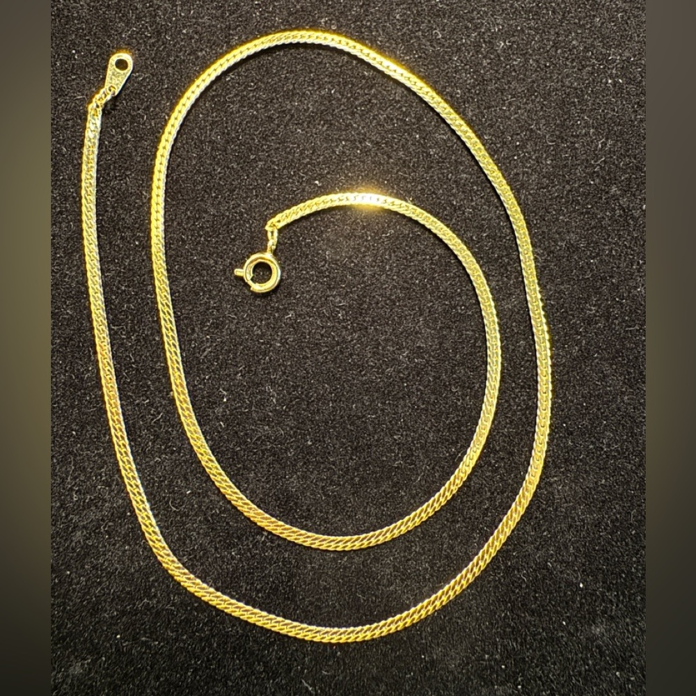 Gold-tone 17" herringbone chain necklace.